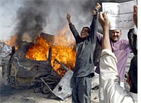 Left: Businesses burning in Watts riot in August, 1965; Right: Car burning in Fallujah riot in April, 2004