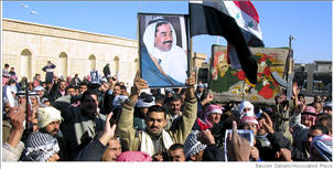 Thousands of people riot and demonstrate in Tikrit, protesting the execution of Saddam Hussein. <font size=-2>(Source: AP/New York Times)</font>