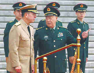 China's General Chen Bingde greets Admiral Mike Mullen in Beijing on Monday (Xinhua)
