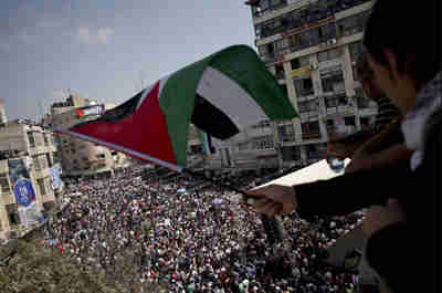 Pro-Palestinian demonstrators in Ramallah, West Bank, on Wednesday (AP)
