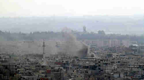 Smoke rises in the city of Latakia.(Reuters)
