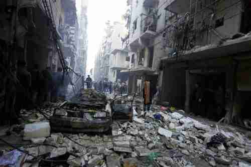 Neighborhood targeted by barrel bombs on Sunday (Reuters)