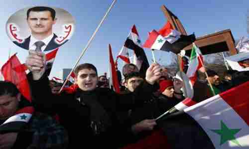 Supporters of Syria's president Bashar al-Assad demonstrate in Geneva on Friday (Reuters)