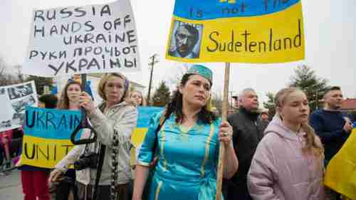 Protesters compare Russia's annexation of Crimea with Hitler's annexation of Sudetenland in 1938 (AP)