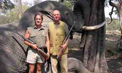 King Carlos poses in front of an elephant that he and his wife killed in Botswana in 2011