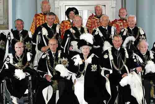 Queen Elizabeth, with her husband Prince Philip to her right, in a group shot with the Knights of the Thistle. (AFP)