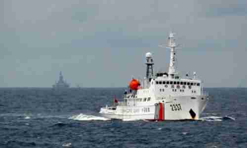 A Chinese Coast Guard vessel passes near a Chinese oil rig within Vietnam's Exclusive Economic Zone (EEZ) in 2012 (Reuters)