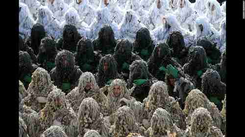 Iranian army troops wearing ghillie camouflage suits in a parade in Tehran (CNN)