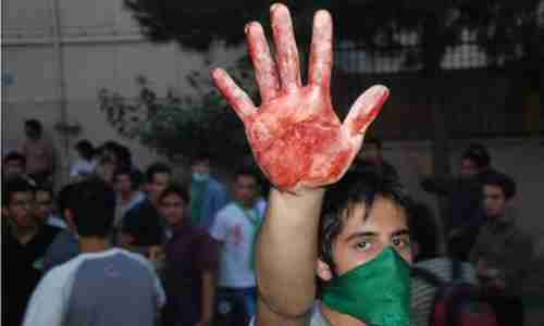 A protester held up a bloody hands in the protests in Tehran following the 2009 elections (Getty)