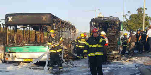 Two burnt out buses following terrorist explosion in Jerusalem on Monday