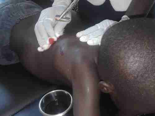 Six-year old Jeremy Otieno, who was hit by a stray bullet during Monday's protests in Kisumu (The Star)