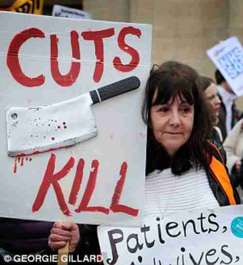 Protester against cuts to UK's National Health Service (Daily Mail)
