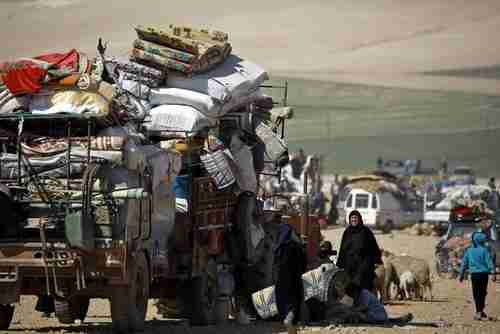 Syrian civilians fleeing Manbij on Wednesday (AFP)