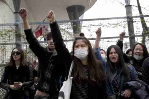 Asian community protests on Tuesday evening in Paris against police killing of Chinese man (AP)