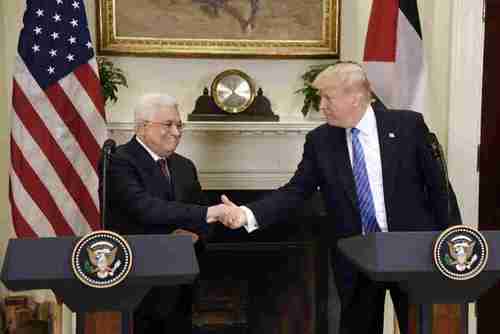 Mahmoud Abbas and Donald Trump shake hands at the White House on Wednesday (Getty)