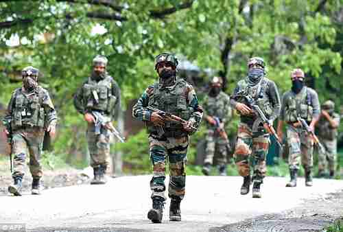 Indian army soldiers conduct a patrol during an operation against suspected rebels in Kashmir (AFP)