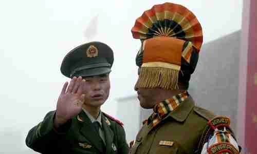 Chinese soldier confronts Indian soldier at border crossing (AFP)
