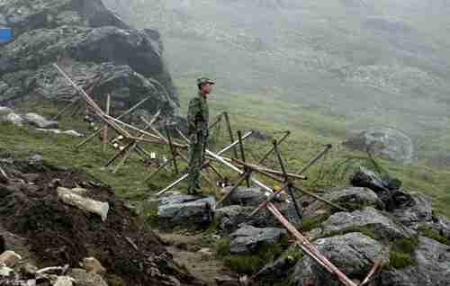Chinese soldier stands guard on the Chinese side of the border crossing between India and China. (AFP)