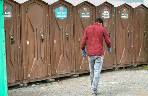 Ten court-ordered toilets for migrants have been set up near Calais (AFP)