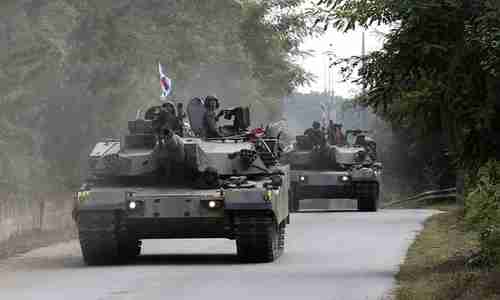 South Korean tanks take part in exercises in Paju, near the border with North Korea, on Monday. Donald Trump tweeted on Tuesday, 'I am allowing Japan & South Korea to buy a substantially increased amount of highly sophisticated military equipment from the United States.'  (AP)