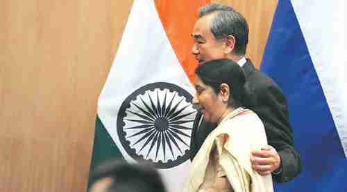 After their meeting, China's foreign minister Wang Yi used his arm to comfort India's foreign minister, External Affairs Minister Sushma Swaraj (Indian Express)