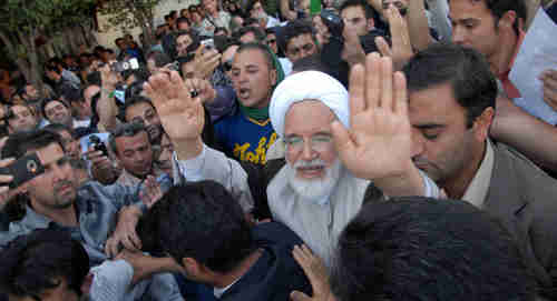 Mehdi Karroubi, opposition leader, surrounded by supporters on June 17, 2009 (Reuters)