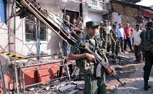 Sri Lanka government troops enforce curfew in Kandy district on Tuesday (Reuters)