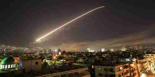 Early Saturday morning in Damascus, Syria, surface to air missiles light up the sky (AP)