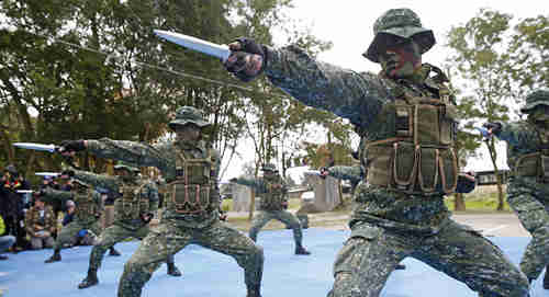Taiwan's frogmen Marines perform close combat drills just a few kilometers from mainland China on the outlying island of Kinmen, Taiwan (AP)