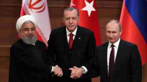 Rouhani, Erdogan and Putin, the three amigos, hold hands prior to their meeting (Reuters)