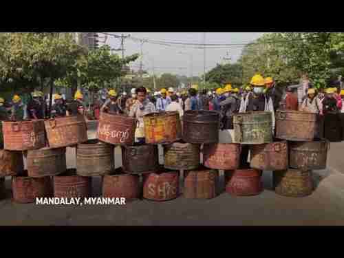 Protesters set up a street blockade in Mandalay, Myanmar (AP)