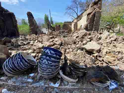 Ironically, some crockery survives an enormous blast that reduced homes to rubble near the Tajikistan - Kyrgyzstan border (BBC)