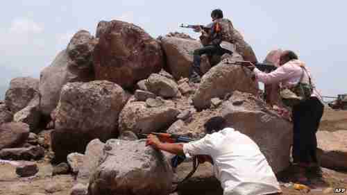 Pro-Hadi fighters in Aden holding a position during clashes with Houthis on Saturday (AFP)