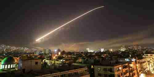 Early Saturday morning in Damascus, Syria, surface to air missiles light up the sky (AP)