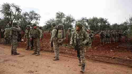Turkish soldiers gather in Idlib, Syria (AFP)