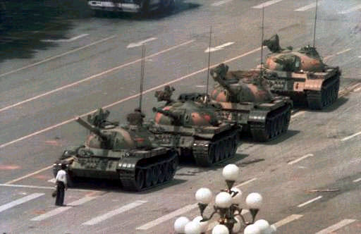 College student blocks path of a row of tanks in Tiananmen Square in China, 1989