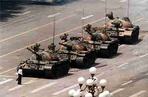 Iconic photo of 'tank man' - student blocking row of tanks in Tiananmen Square