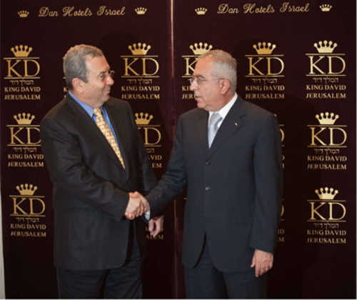 Salam Fayyad and Ehud Barak shake hands at King David Hotel, July 2010 (Ynet)