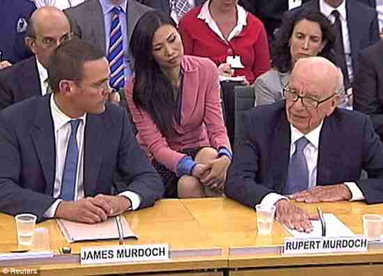 Rupert Murdoch at right, his wife Wendi Deng in the pink jacket, and his son James (Daily Mail)