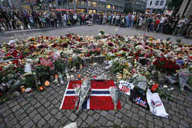 Mourners gather around an improvised shring in Oslo (Reuters)