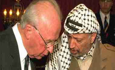 Israeli Prime Minister Yitzhak Rabin and PLO chairman Yasser Arafat signing the Oslo Accords in 1993 (Reuters)