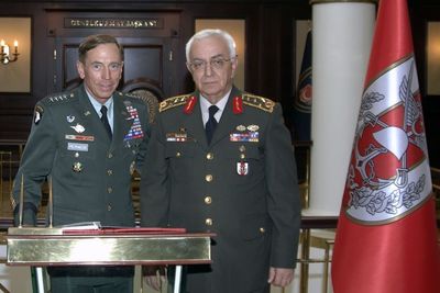 U.S. Gen. David Petraeus (now the designated CIA chief) poses with Turkey's Chief of Staff, Gen. Isik Kosaner, on July 18, 2011 (AP)