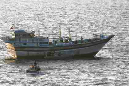 U.S. boarding team operates on the deck of the Iranian-flagged fishing dhow