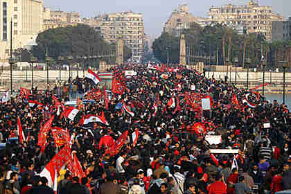 Thousands of Egyptians march in a protest from the Al-Ahly club to the headquarters of the ministry of interior in Cairo. (AFP)