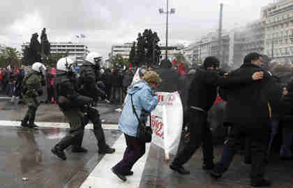 Police try to disperse anti-austerity protesters in Athens on Tuesday (Reuters)