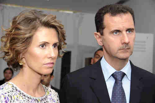 Bashar al-Assad, who wears aHitler-like mustache, and his lovely wife Asma.  Supposedly, thee-mail messages contain personal information about their relationship.(AP)