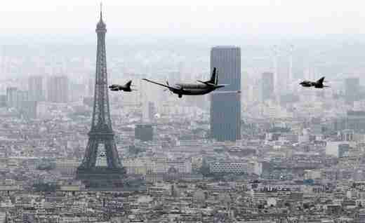 French fighters and reconnaissance aircraft fly over Paris during the Bastille Day military parade in Paris on July 14 (AFP)