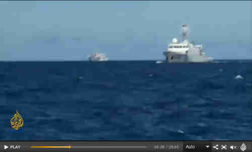 Two Chinese warships approach the al-Jazeera vessel