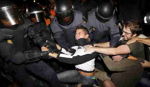 Riot police struggle with protesters during demonstrations in Madrid against austerity cutbacks. (EPA)