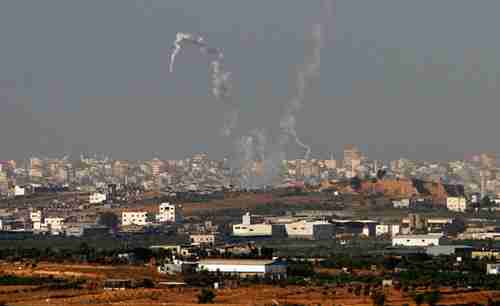 Trails of smoke are seen after the launch of rockets from the northern Gaza strip towards Israel on Sunday. (Reuters)